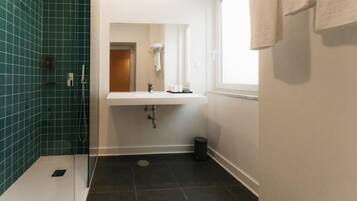 Shower, free toiletries, hair dryer, towels