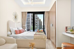Standard Apartment, Pool View | In-room safe, individually decorated, individually furnished, desk - Unique Studio in Azizi Riviera (Dubai)
