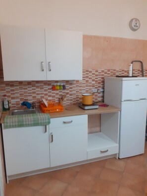 Departamento | Cocina privada | Parrilla de estufa y utensilios de cocina