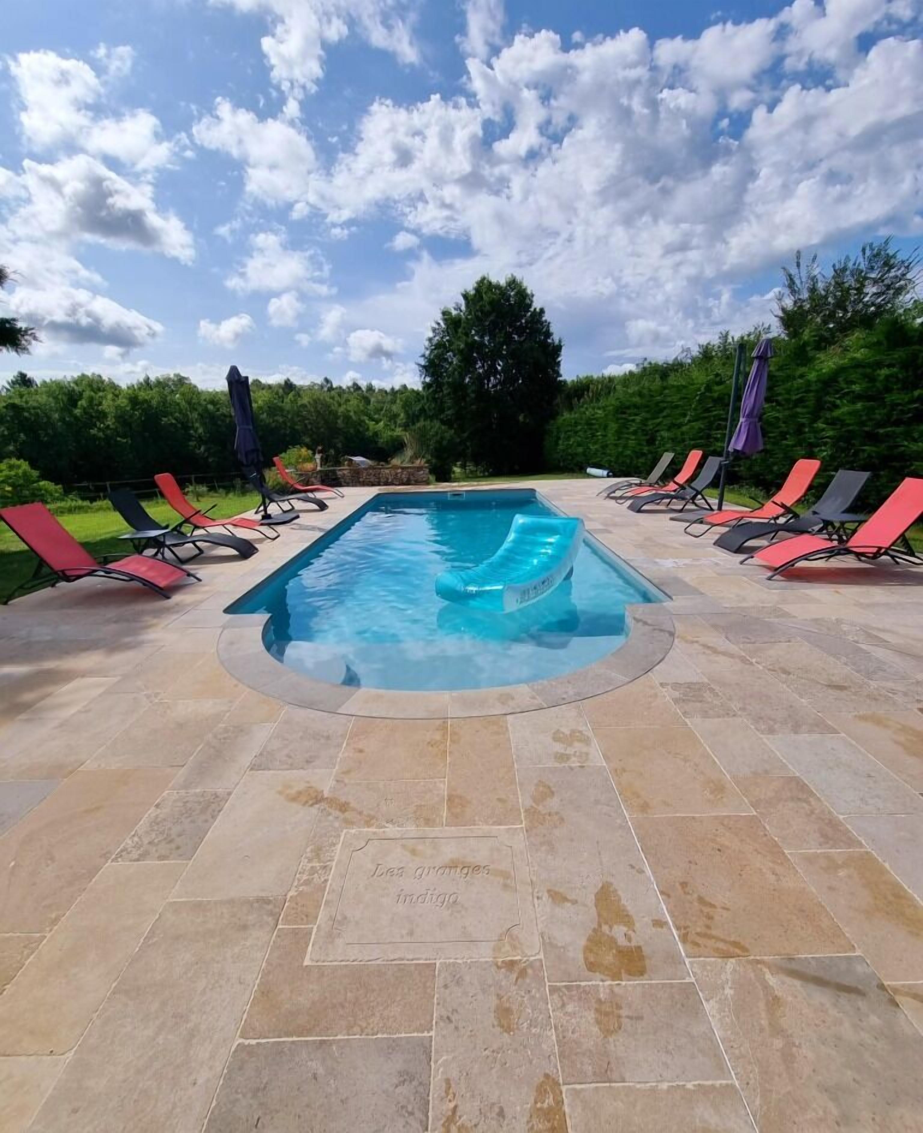 Seasonal outdoor pool, open 10:00 AM to 9:00 PM, pool umbrellas