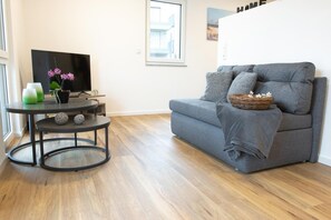 Appartement Confort, vue établissement | Coin séjour