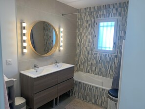 Shower, hair dryer, towels, toilet paper