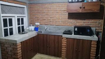 Mini-fridge, microwave, cookware/dishes/utensils