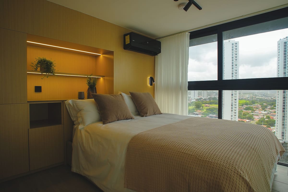 Signature Studio Suite, Courtyard View | In-room safe, desk, laptop workspace, iron/ironing board