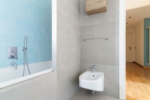 Hair dryer, bidet, towels, toilet paper