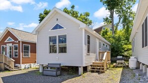 A small, single-story cabin with a gable roof, a front porch, and a small deck area. - 3 Usen Lane near all the fun (Old Orchard Beach)