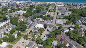 An aerial view of a coastal town with residential areas, roads, and a beach. - 3 Usen Lane near all the fun (Old Orchard Beach)