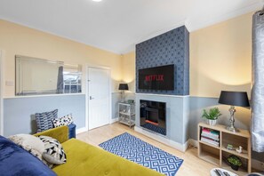 Smart TV, fireplace, books