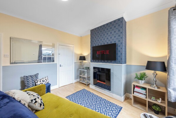 Smart TV, fireplace, books
