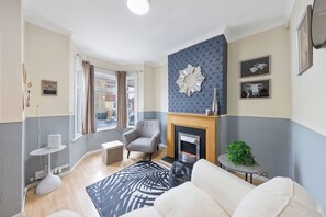 Smart TV, fireplace, books