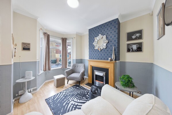 Smart TV, fireplace, books