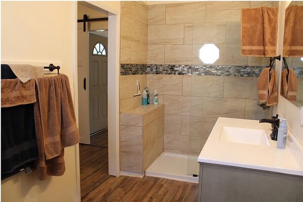 Shower, hair dryer, towels, soap