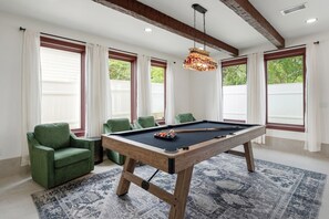 A pool table with chairs, a chandelier, and large windows with curtains. - Saltwater spa & pool, Beach@3min walk, Golf cart, Elevator (Destin)
