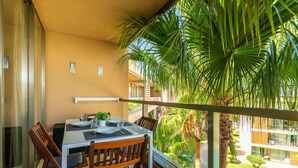 Outdoor dining - Salgados Beach Paradise Apartment with Shared Pool, Wi-Fi, and Air Conditioning (Guia)
