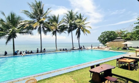 Outdoor pool, free cabanas. La Plage Beach Club & Resort