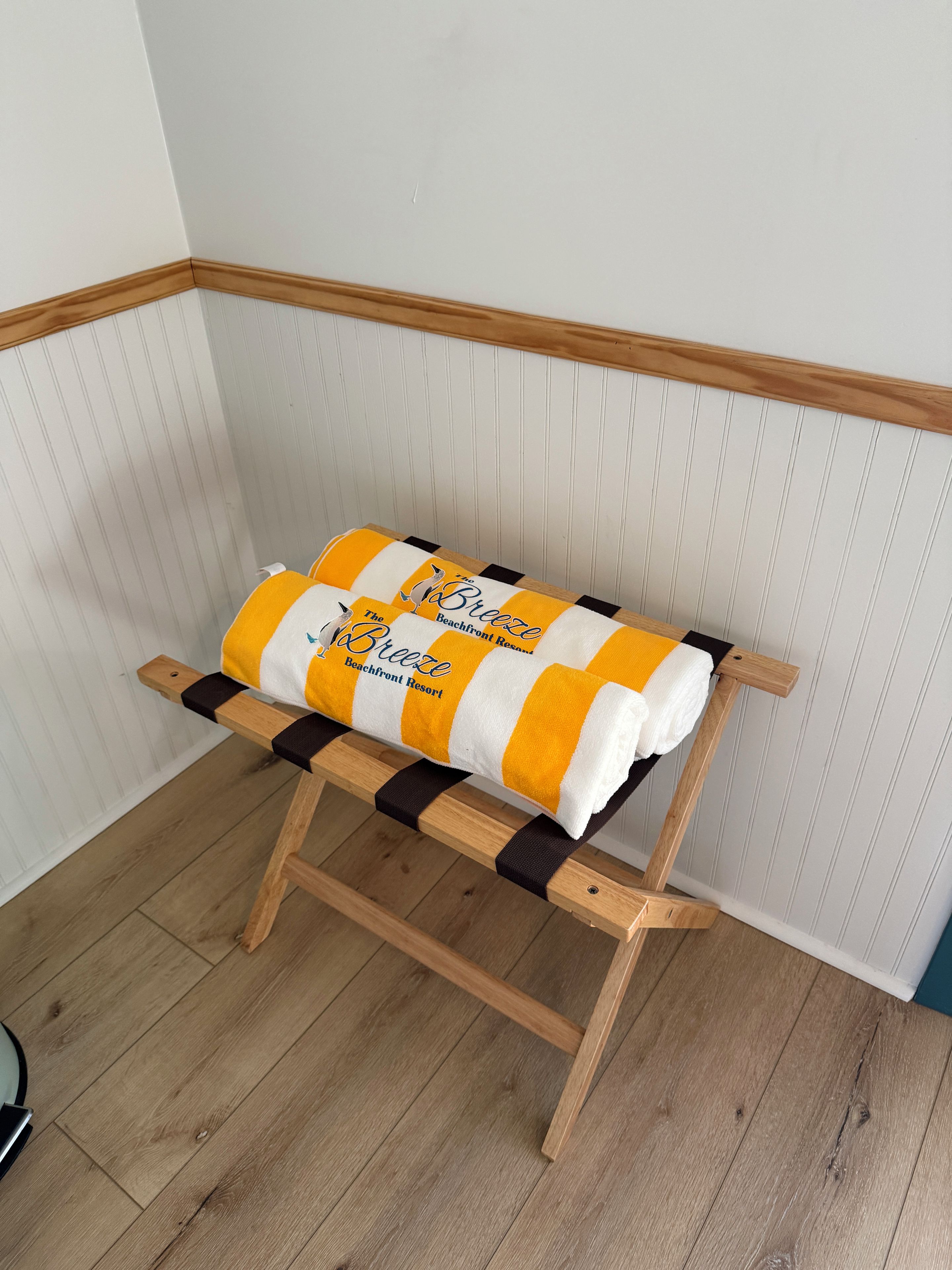 A corner bench with a striped towel.
