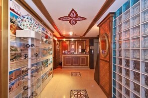 A hotel lobby with a reception desk, a decorative ceiling, and a patterned floor. - Hotel Agan Oldcity Istanbul (Istanbul)