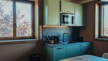 Chambre Quadruple Deluxe | Coin cuisine privé