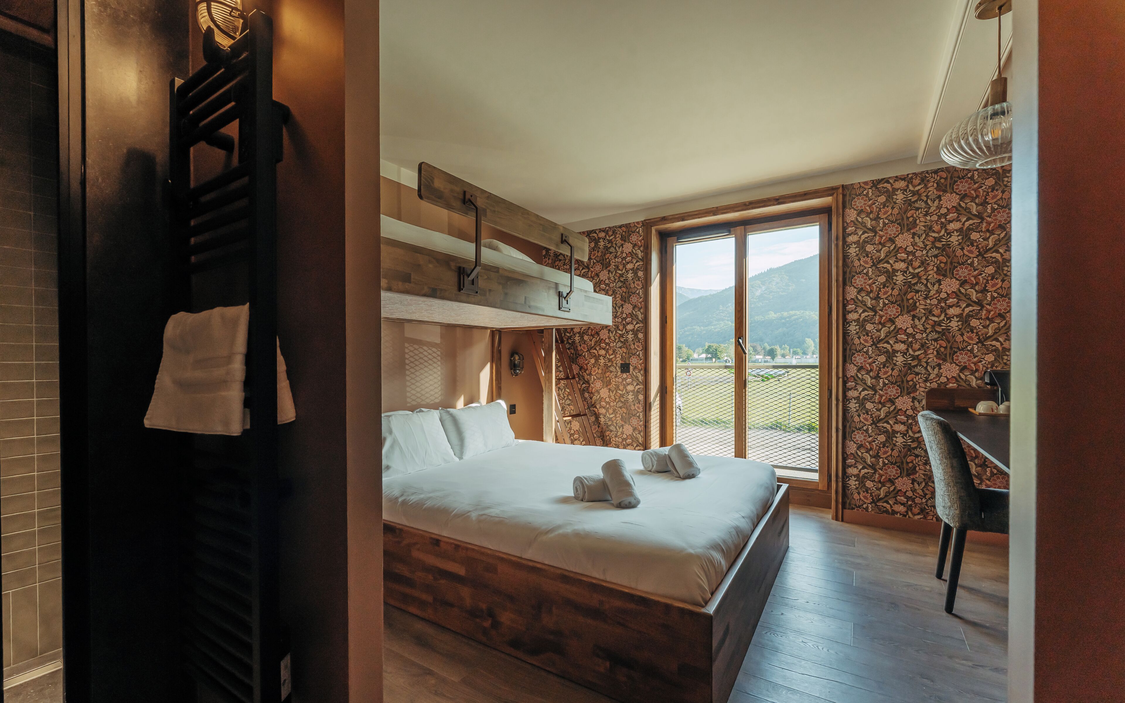 Premium bedding, memory-foam beds, desk, laptop workspace