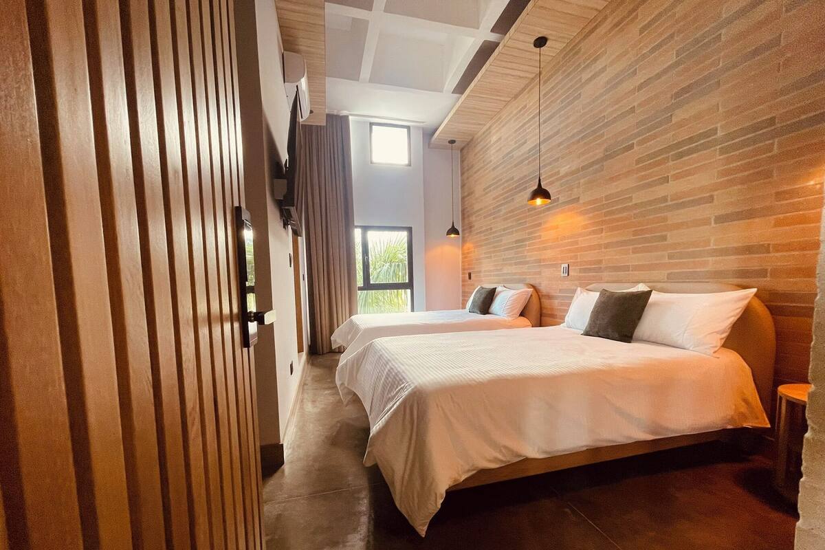 Deluxe Quadruple Room, City View | Premium bedding, down duvets, desk, laptop workspace