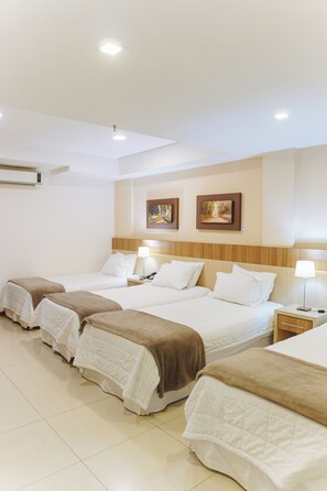 Comfort Quadruple Room | Premium bedding, down comforters, in-room safe, desk