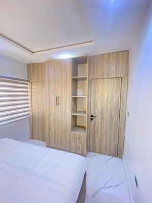 Desk, laptop workspace, blackout drapes, iron/ironing board - Aurelia Apartments (Abuja)