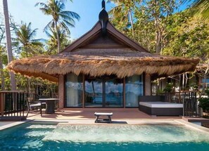 A thatched-roof structure with a pool in front. - El Nido Resorts Pangulasian Island (El Nido)
