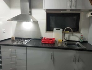 Casa superior, patio, vistas al patio | Cocina privada | Máquina de café espresso