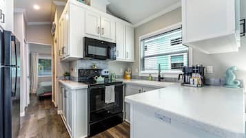 1 Bed/1 Bath - Pet Friendly , Sleeps 2 | Private kitchen | Full-size fridge, microwave, oven, stovetop