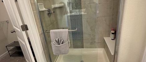Shower, towels, soap, toilet paper
