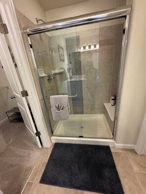 Shower, towels, soap, toilet paper