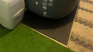 A large bean bag chair with a water bottle and a small white container beside it. - Charming pet friendly mountain views . Hottub included (Colorado Springs)