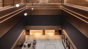 A modern interior with a central open space, multiple levels, and a mix of natural and artificial lighting. - Hotel Indigo Xi An High Tech Zone by IHG (Xi'an)