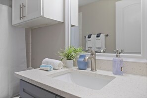 Hair dryer, towels, soap, toilet paper