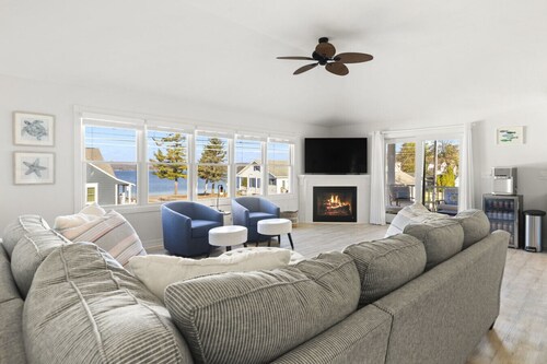 Modern-coastal retreat with lake views, covered deck, and walkable downtown Beulah location.