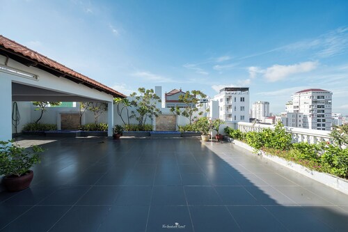 Cozy 1BR condo with hardwood floors and rooftop sunset garden in Phnom Penh