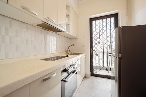 Cozy 1BR condo with hardwood floors and rooftop sunset garden in Phnom Penh