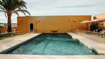 Outdoor pool, open 11:00 AM to 7:00 PM, pool umbrellas, sun loungers