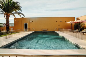 Outdoor pool, open 11:00 AM to 7:00 PM, pool umbrellas, sun loungers