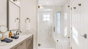 A modern bathroom with a large mirror, a sink, and a shower area. - Vineyard Views w/ Pool & Game Room Near Trails, Wineries Beginnings Ranch & Vineyard by Avantstay (Paso Robles)