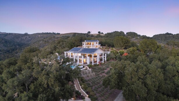 A large, modern house with multiple levels, surrounded by dense forest and hills. - Vineyard Views w/ Pool & Game Room Near Trails, Wineries Beginnings Ranch & Vineyard by Avantstay (Paso Robles)