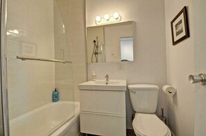 Shower, hair dryer, towels, shampoo