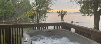 Best in QC! AweSpired Riverfront Retreat – Hot Tub, Fireplaces & Stunning Views!