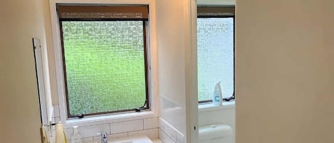 Shower, eco-friendly toiletries, towels, soap