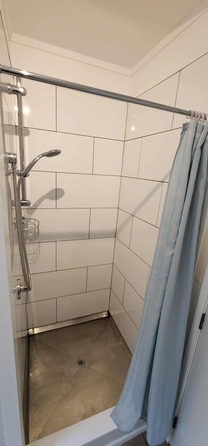 Shower, eco-friendly toiletries, towels, soap