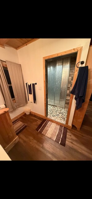 Shower, towels, soap, toilet paper