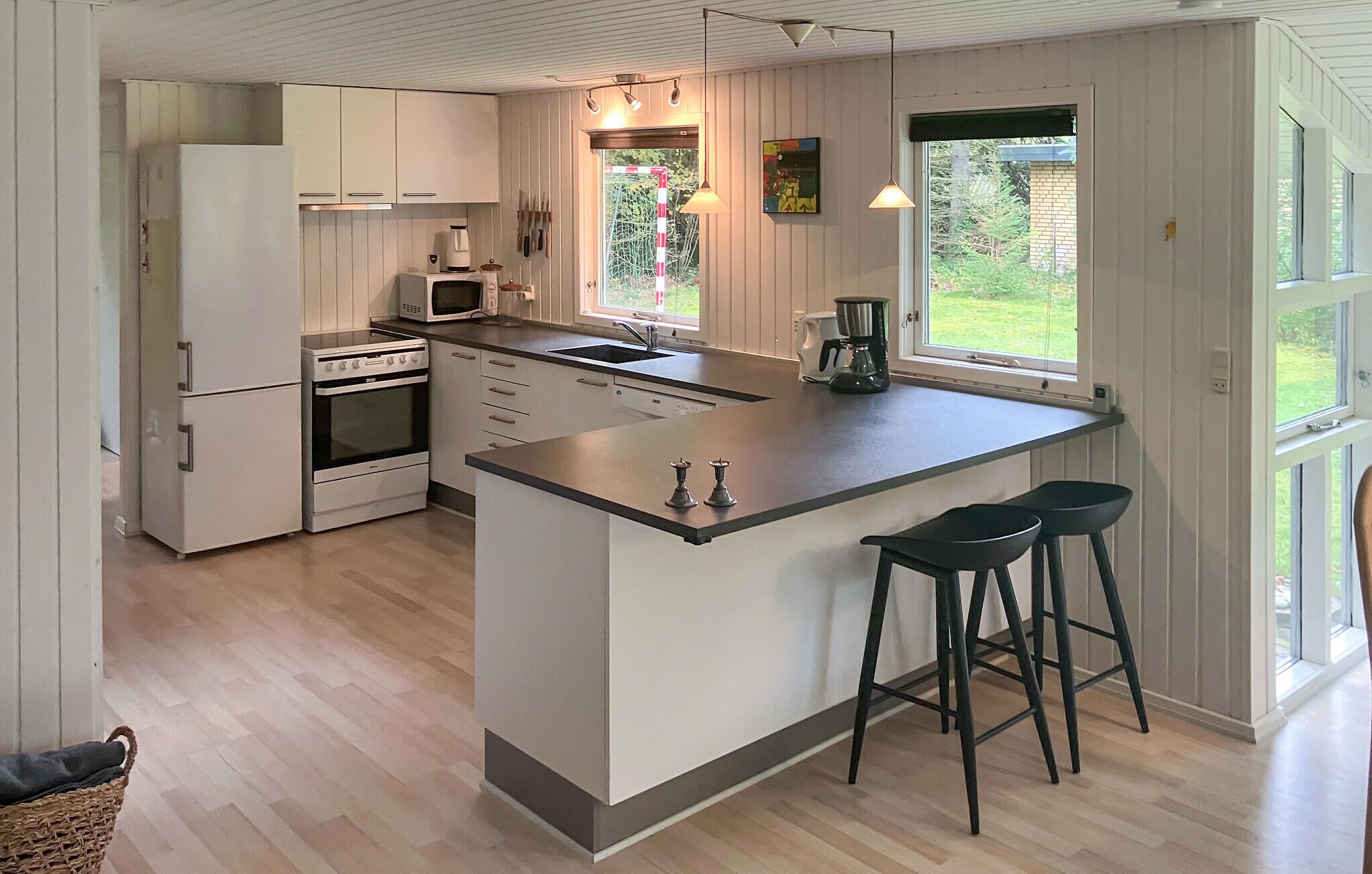 Fridge, stovetop, dishwasher, coffee/tea maker