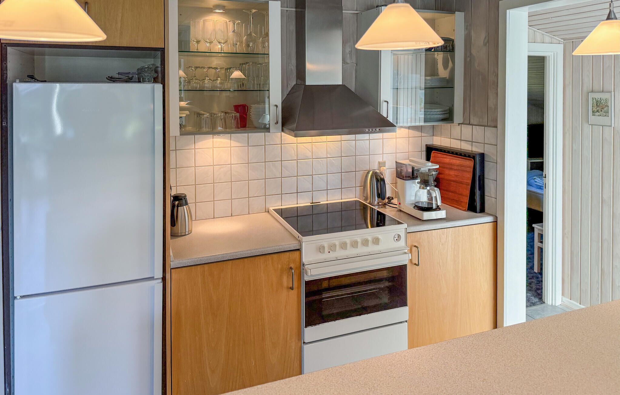 Fridge, stovetop, dishwasher, coffee/tea maker