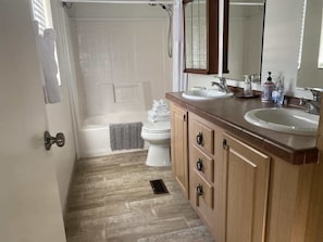 Shower, hair dryer, towels, shampoo