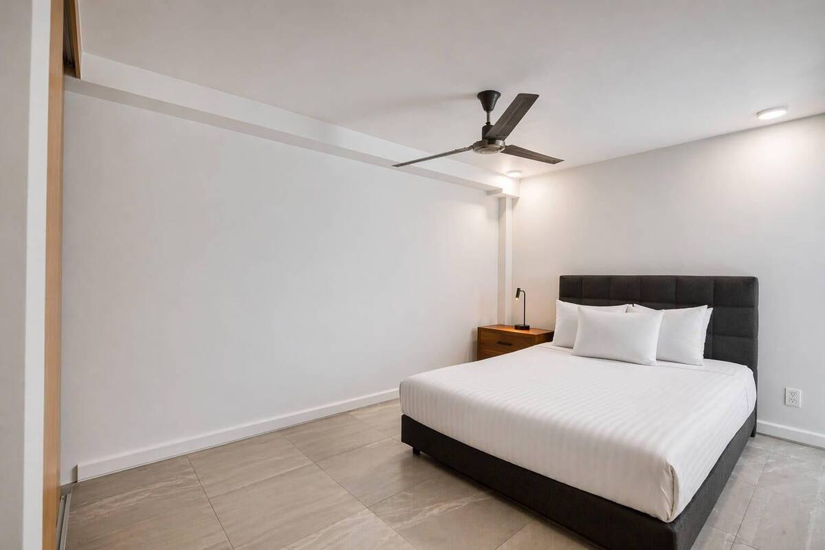 Apartment, 1 Queen Bed | Laptop workspace, blackout drapes, WiFi (free), individually decorated